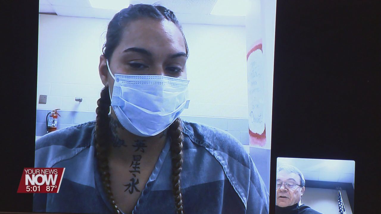 Woman suspected in double homicide makes first court appearance
